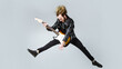 Brutal bearded man jumping with electric guitar. Rock musician. Heavy metal player. Music star.