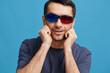 © SHOTPRIME STUDIO - Cheerful man 3D glasses cinema fun emotions blue background