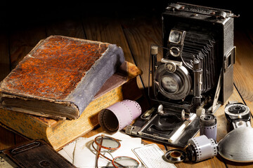 Wall Mural - Old camera in the studio on an old background