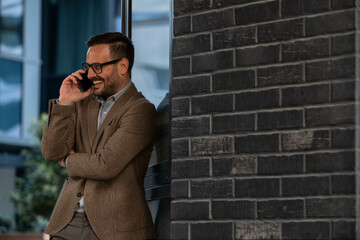 Wall Mural - Smiling executive talking on phone