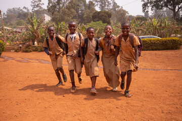 young group of african children all together at school yard having fun playing holding hands