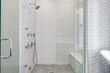 © Gina - Modern Luxury Bathroom. All white bathroom with glass tile. Contemporary bath and shower design. Glass enclosed shower.