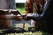 © sittinan - farmer plants tomato seedlings in an organic garden or farmer  analyze organic farm . can be use for agriculture smart farm business concept.