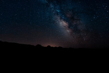 The Milky Way Galaxy Over The Landscape In Silhouette