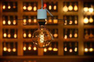 Wall Mural - Close-up shot of a vintage round shaped glowing led light bulb at a shop