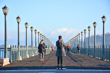 Lamp Posts Lining A Historic Wooden Pier At The Embarcadero Waterfront San Francisco, California