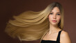 © Alena - Portrait of a beautiful girl with long airy hair. Brown background.