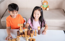 Children Boy And Girl Playing With Constructor Wooden Block Building, Happy Little Kids Play Wood Block Stacking Board Game At Home, Activities Learning Creative, Toys For Preschool And Kindergarten