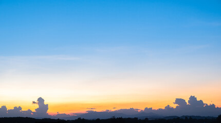Wall Mural - Colorful sunset and sunrise with clouds. Blue and orange color of nature. Many white clouds in the blue sky. The weather is clear today. sunset in the clouds. The sky is twilight