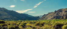 Panoramic Of Mountains With Rock Formations And Low Plants In The Patagonian Plateau Of Argentina