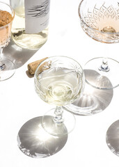 Sticker - Top view of white wine glasses shining under the sunlight