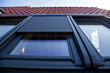 canvas print picture - Nahaufnahme von einem neuen Dachfenster mit Rollladen