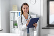 © Syda Productions - medicine, healthcare and profession concept - smiling female doctor with stethoscope and clipboard at hospital