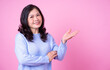 © Timeimage - Portrait of middle aged Asian woman on pink background