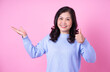 © Timeimage - Portrait of middle aged Asian woman on pink background