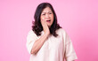 © Timeimage - Image of middle aged Asian woman on pink background