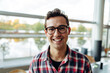 © Jacob Lund - Portrait of a happy young businessman in office
