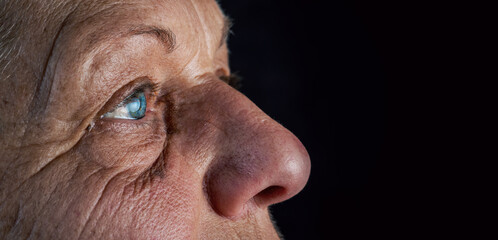 Close up, macro photo of a senior female color eyes, iris, pupil, eye lashes, eye lids.