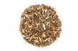 Dried medicinal herbs of pile in form circle on white isolated background.