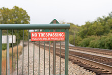 "no Trespassing" Sign In Front Of Railroad Tracks.