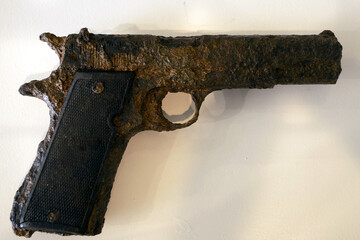 old rusted pistol being underwater for long time