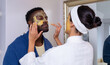 © WavebreakMediaMicro - Caucasian young woman applying facial cream on face of boyfriend in bathroom at home