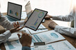 © Natee Meepian - Business people are meeting for analysis data figures to plan business strategies. Business discussing concept