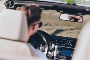 Poster - Photo of pretty attractive husband wear casual clothes sunglass riding cabriolet looking back mirror outside countryside