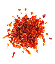 Dried red paprika flakes isolated on white background. Spices and herbs. Top view.