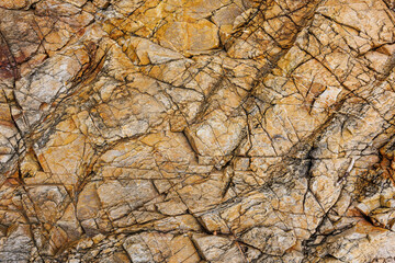 Wall Mural - textures and patterns of natural broken rocks and erosion of sea water over time