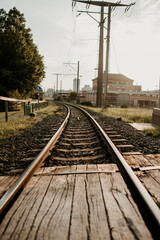 Sticker - Vertical shot of a railway with buildings in the background