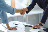 Fototapeta  - Business success. Businessman shaking hands agreement confirmed in the investment business.