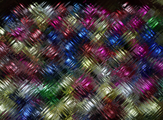 Colored blurred abstract pattern on a dark background.