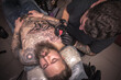 © Mr. Prof - Tattoo master demonstrates the process of getting tattoo in a workshop studio