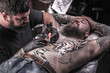 © Mr. Prof - Tattoo artist formulates a tattoo