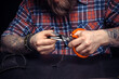 © Mr. Prof - Currier of leather demonstrates leather cutting process in his leather studio