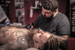 © Mr. Prof - Professional tattooer makes tattoo in tattoo parlor
