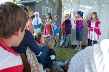 Children Dressed In Costumes At Family Reunion