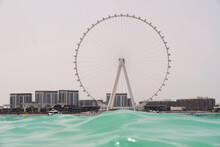 Shot From The Sea Overlooking Dubai Ferris Wheel
