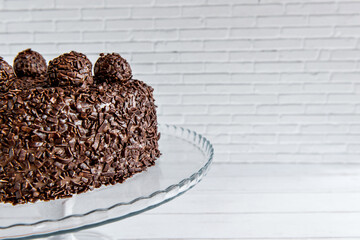 Chocolate cake with brigadeiro grains, delicious dessert close up.