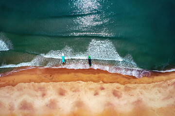 Bird's eye view of the sea shore with two boats. Guangdong, China.