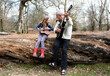 © Cavan Images - grandfather teaching his granddaughter to play guitar in the forest