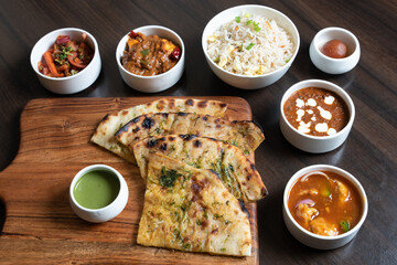 Sticker - Shot of the roti sliced and types of side dishes kept on the table for taste