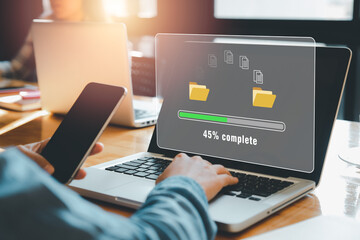 Transfer files data system relocation concept, Person hand using laptop computer waiting for transfer file process with loading bar icon on virtual screen.