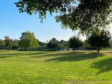 Sunny Public Community Park Shady Afternoon Sun Shadows Empty Clean Blue Sky Hillside Daytime