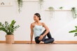 © 220 Selfmade studio - Calm of Asian woman in sportwear stretching muslce to warm up breathing and meditation with yoga at home.Healthy female doing yoga Feeling so comfortable and relax,Wellness Yoga Healthcare Concept