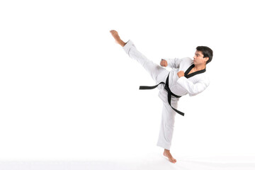 Wall Mural - Taekwondo high kick - black belt  taekwondo athlete martial arts master , handsome man show high kick pose during fighter training isolated on white background