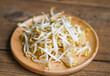 Bean sprouts on wooden plate table background in the kitchen, Raw white organic bean sprouts or mung bean sprout for food vegan