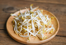 Bean Sprouts On Wooden Plate Table Background In The Kitchen, Raw White Organic Bean Sprouts Or Mung Bean Sprout For Food Vegan
