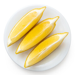 Wall Mural - Three segments of fresh lemon on white plate from above.